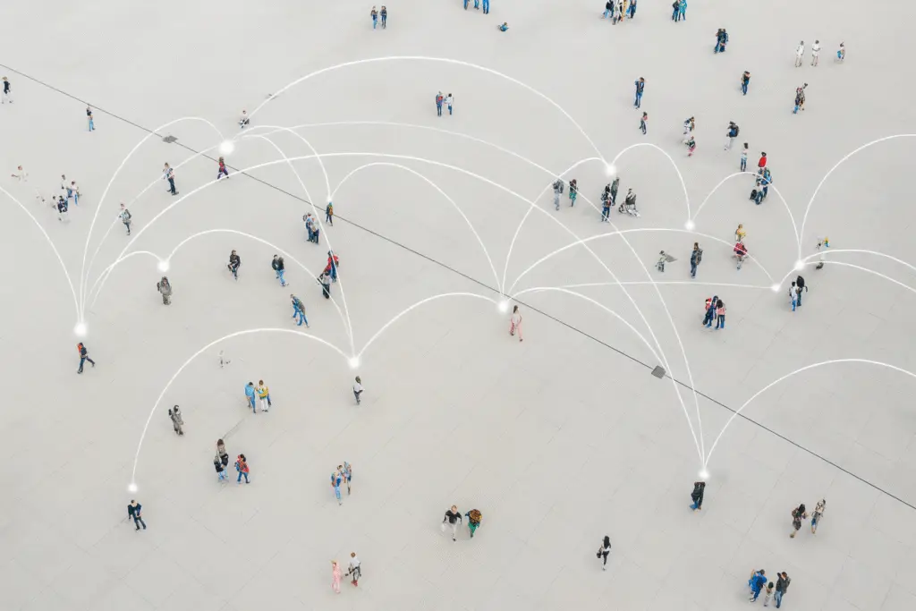 People connected by digital network lines representing healthcare referral management.